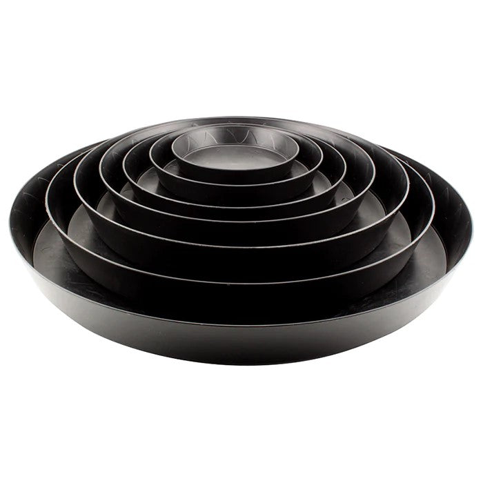 black plastic saucers of different sizes stacked