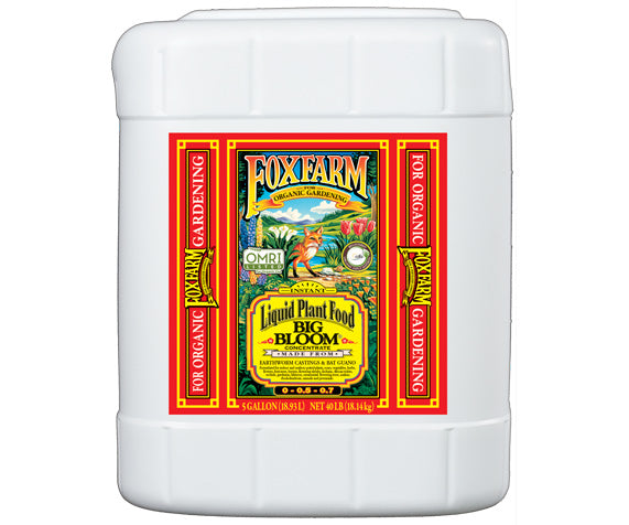 5 Gallon size white plastic container with red label and yellow lettering of plant food