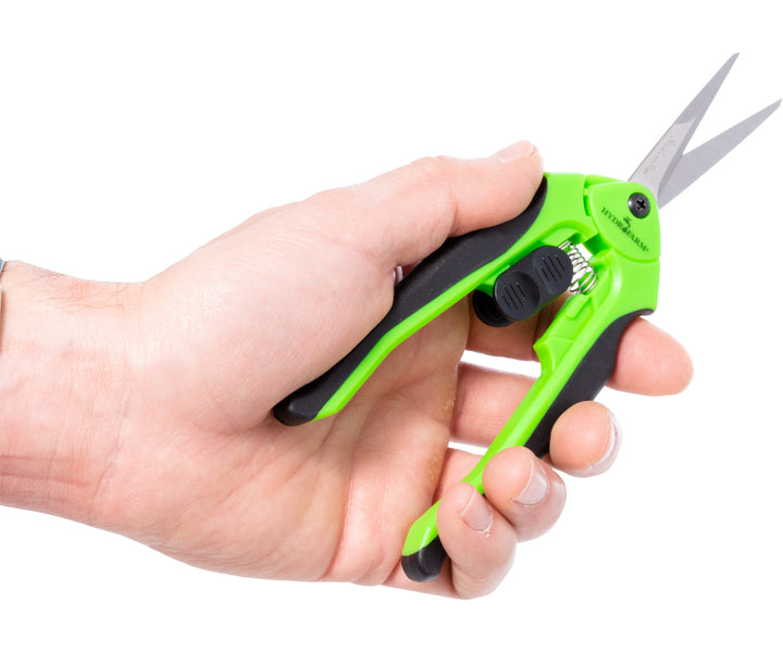 Hand holding Trim Fast ergonomic stainless pruner