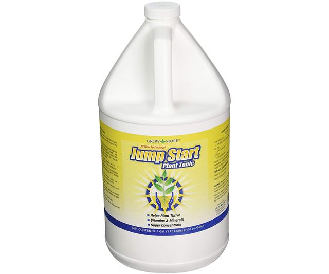 a gallon of fertilizer liquid on a white background